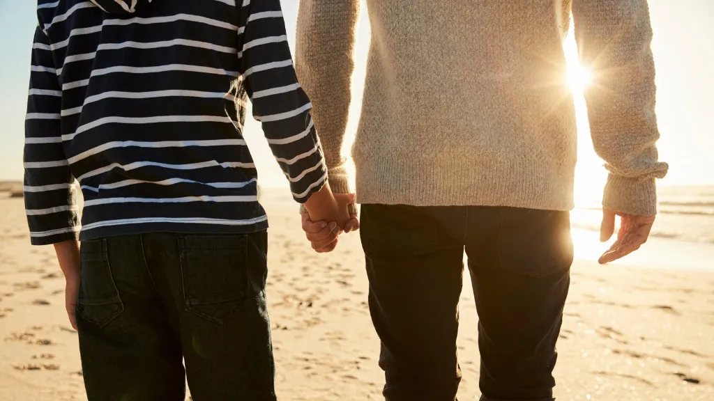 Father and son from behind. Image resource Father and son from behind. Image resource